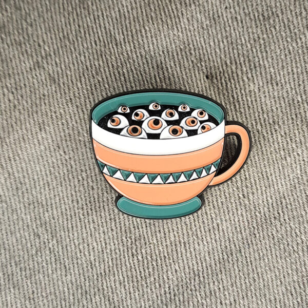 Cup of eyes kitűző